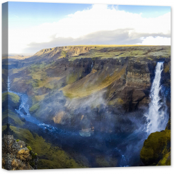 Tablou luminos in intuneric GlowforHome Minunata cascada in canionul din Islanda 80 cm x 80 cm 